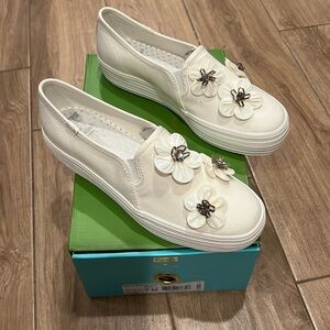 White Kate Spade x Keds slip on triple decker with flowers.